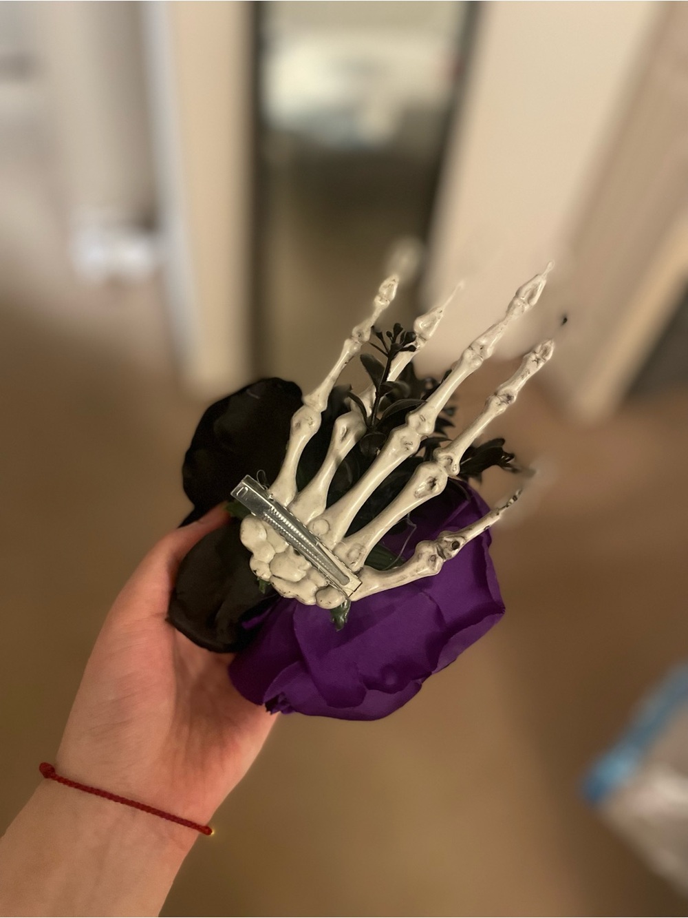 Vintage Faux Floral Corsage with White Skeleton Hand and Purple & Black Blooms